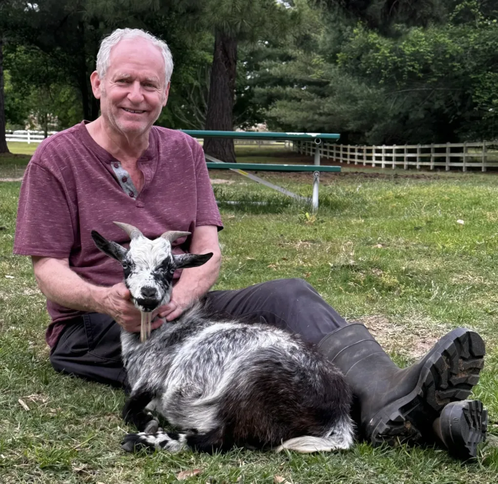 Steve, Owner of Mattress Outlet, Poses with His Adorable Goat, Vinny!