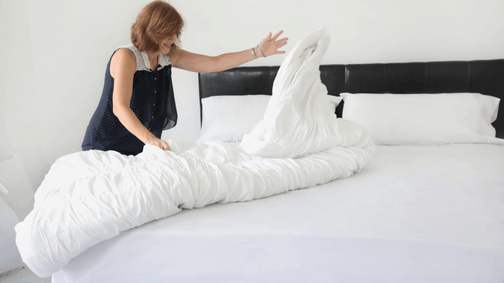 woman making bed