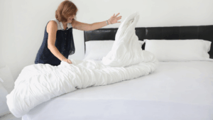 woman making bed